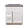 White bathroom vanity cabinet with gray concrete countertop and vessel sink, featuring two center doors and two left side drawers