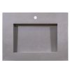 Gray concrete rectangular vessel sink with white faucet hole on plain background