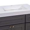 Close-up of white bathroom sink basin with faucet hole on dark vanity cabinet