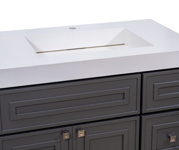 Close-up of white bathroom sink basin with faucet hole on dark vanity cabinet