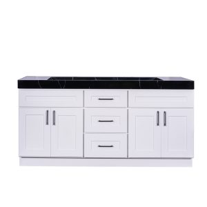 White double bathroom vanity with black marble countertop, dual cabinets with handles, and center drawers