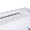 Close-up interior view of white undermount sink with stainless steel drain and curved basin design