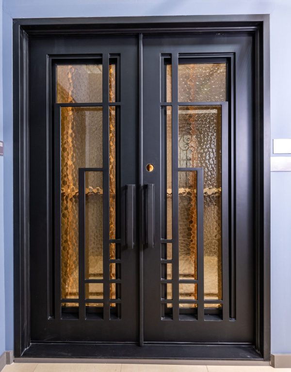 Black double doors with 4-pane windows featuring golden hammered glass panels and horizontal metal muntins