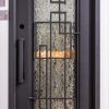 Black modern entry door featuring asymmetrical rectangular window design with textured glass and geometric black frame pattern