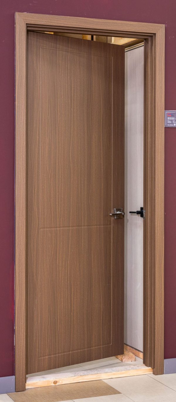 Open wooden interior door with walnut finish and glass panel showing modern minimalist design