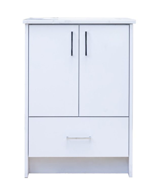 White bathroom vanity cabinet with marble countertop, two cabinet doors with black handles, and one drawer with chrome handle