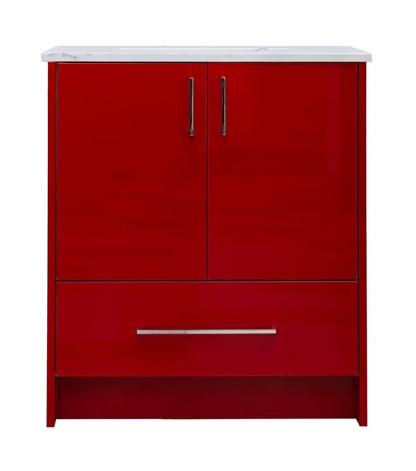 Red bathroom vanity cabinet with white marble countertop, two cabinet doors with gray handles, and one drawer with silver handle