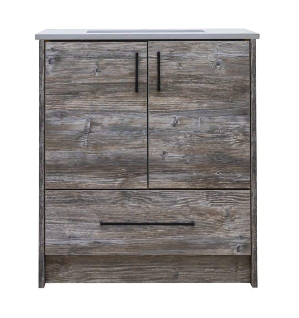 Rustic gray wood bathroom vanity with gray stone countertop, two cabinet doors with black handles, and one drawer