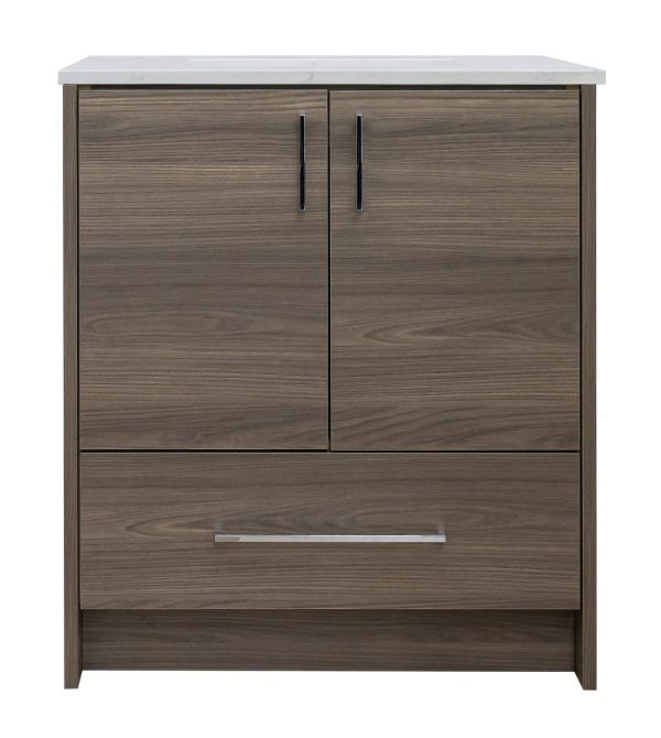 Medium brown wood bathroom vanity with white marble countertop, two cabinet doors with black handles, and one drawer