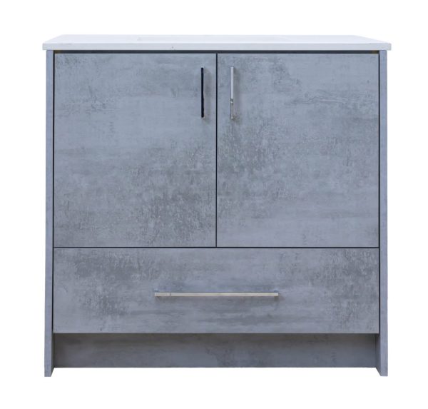 Light gray concrete-textured bathroom vanity cabinet with white marble countertop, two cabinet doors with metallic handles, and one drawer below