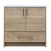 Light natural wood bathroom vanity cabinet with white marble countertop, two cabinet doors with black handles, and one drawer below