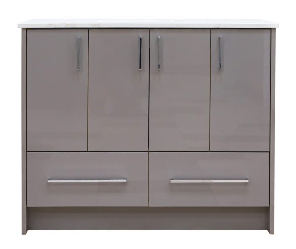 Modern taupe bathroom vanity with white marble countertop, four upper cabinet doors with chrome handles, and two lower drawers