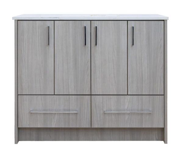 Gray wood grain bathroom vanity with four upper cabinet doors and two lower drawers, featuring black handles and a white countertop with integrated sink