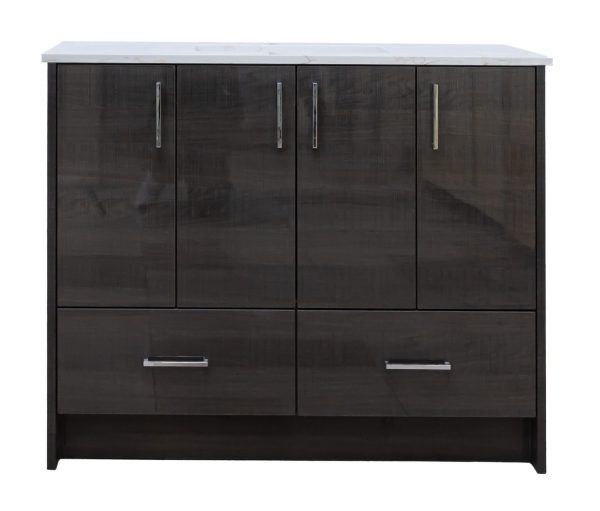 Modern dark wood bathroom vanity with white marble top, four cabinet doors with chrome handles, and two lower drawers