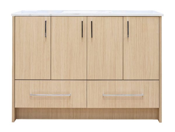 Light natural oak wood bathroom vanity with four upper cabinet doors and two lower drawers, featuring chrome hardware and white marble countertop