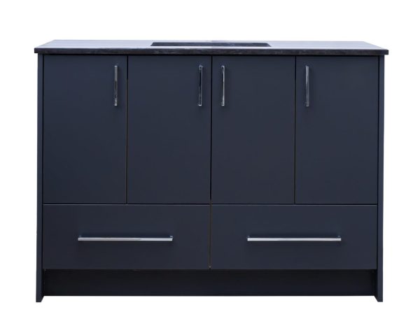 Dark navy blue bathroom vanity with four upper cabinet doors and two lower drawers, featuring chrome handles and a black countertop with integrated sink