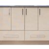 Light natural wood bathroom vanity with four upper cabinet doors and two lower drawers, featuring chrome handles and a dark gray countertop with integrated sink