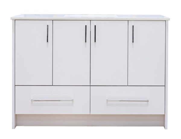 Modern white bathroom vanity cabinet with light wood trim, four upper cabinet doors with black handles, and two lower drawers with stainless steel bar pulls