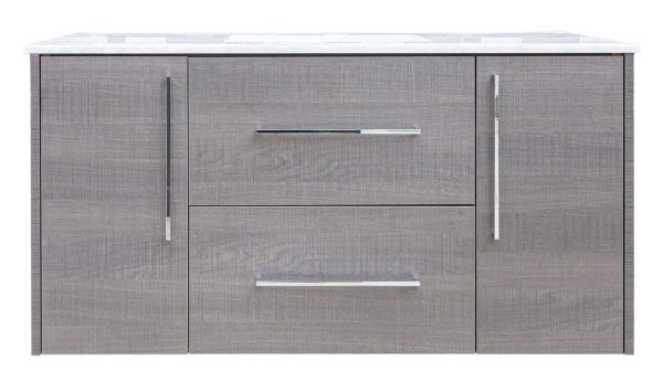 Gray textured bathroom vanity with white countertop, two cabinet doors with silver vertical handles, and two center drawers with metallic handles
