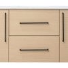 Light oak wooden bathroom vanity with white countertop, two cabinet doors with vertical black handles, and two center drawers