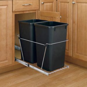 Under-sink pull-out waste bin system with two black containers in cabinet
