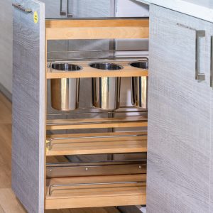 Tall pull-out wooden spice rack organizer with stainless steel containers and natural wood shelving