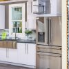 Modern kitchen display with white cabinetry, stainless steel refrigerator, farmhouse sink and blue subway tile backsplash