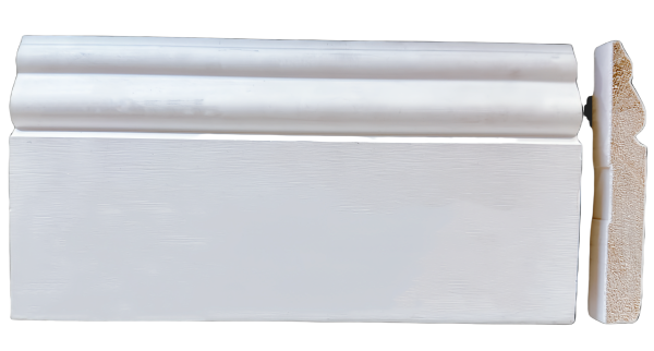 White painted baseboard trim with rounded decorative edge molding and wood core visible
