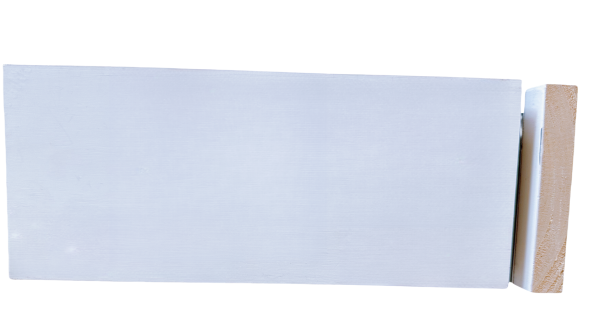 White primed baseboard trim with simple straight profile and tan wood backing