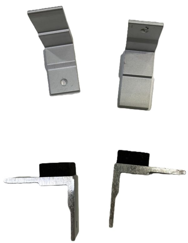 Metal shelf brackets and clips in silver and black, including angled support brackets and L-shaped corner brackets for furniture assembly