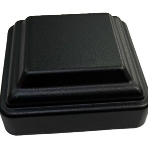 Black plastic post cap with stepped pyramid design for fence posts or deck railings