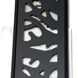 Black decorative metal railing or trim with abstract cutout pattern and wood grain insert