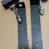 Metal cabinet hardware kit with blue-gray mounting brackets, bolts, and wrapped handle