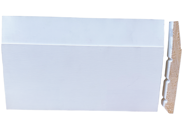 White painted baseboard with decorative wavy edge pattern and wood core
