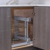 Kitchen corner cabinet with pull-out wire basket organizer system closed showing three-tier chrome shelving design for interior storage