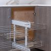 Kitchen corner cabinet with pull-out wire basket organizer showing extended two-tier chrome shelving system partially pulled out