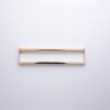 Champagne gold rectangular handle with dual-tone finish and open design on neutral background