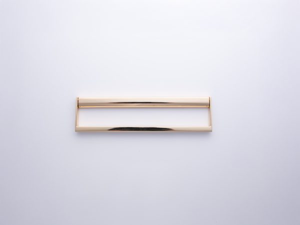 Champagne gold rectangular handle with dual-tone finish and open design on neutral background