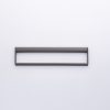 Gray rectangular frame handle with open center design mounted on white wall