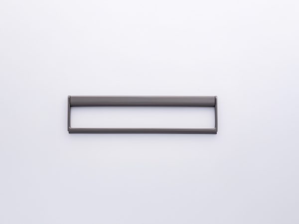 Gray rectangular frame handle with open center design mounted on white wall