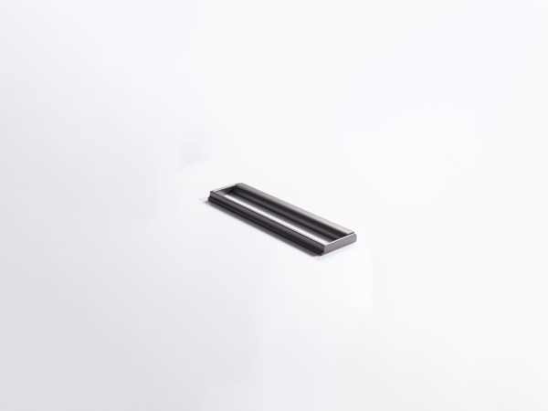 Black metal recessed handle with minimalist design on white background