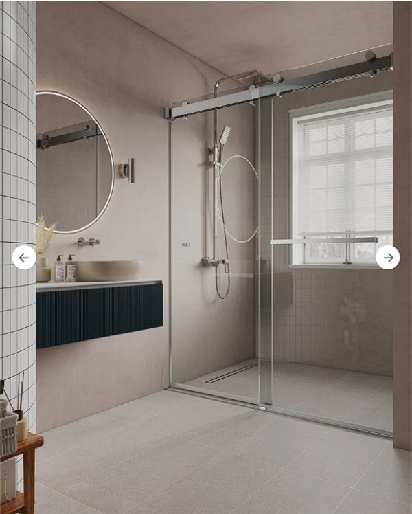 Modern bathroom design with sliding glass shower door, floating black vanity, circular mirror, beige tiled walls, and natural light from window