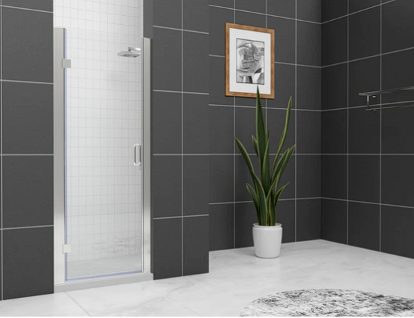 Modern bathroom with black large-format tile walls, frameless glass shower door, white floor, potted plant and framed artwork