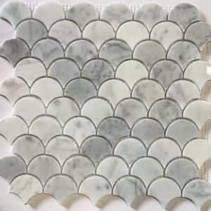 Marble mosaic tile pattern featuring curved fan-shaped white and gray tiles arranged in repeating rows