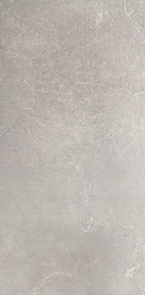 Light gray concrete or stone tile texture with subtle veining and natural surface variations