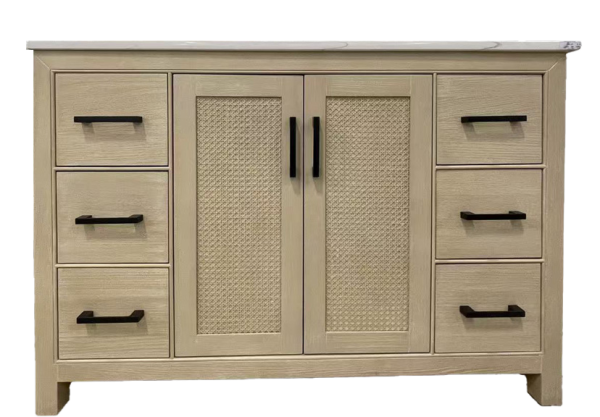 Natural wood bathroom vanity with dual caned cabinet doors, six side drawers, and white marble countertop