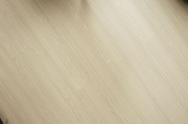 Light blonde wood-look laminate flooring with diagonal plank pattern
