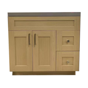 Natural wood vanity cabinet with two doors, center divider, and two right-side drawers with gray countertop