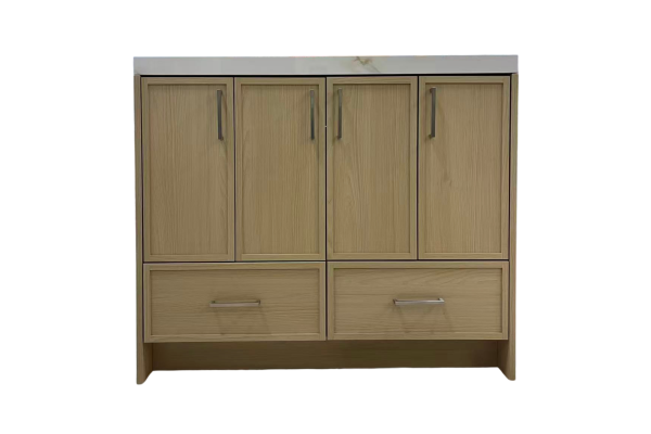 Light wood bathroom vanity with four upper cabinet doors and two lower drawers with brushed metal pulls