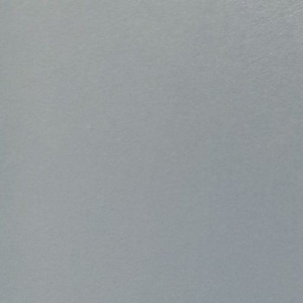 Solid light gray colored surface with subtle texture and matte appearance